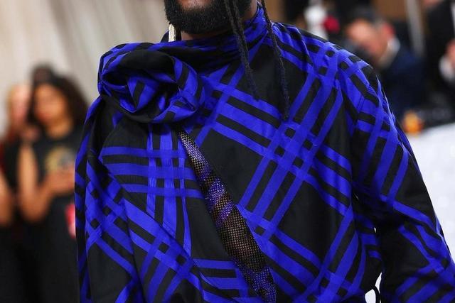 Burna Boy's outfit at the Met Gala has received praise from both fashion enthusiasts and fans, with many applauding his bold and stylish choice of attire.  [Yabaleftonline]