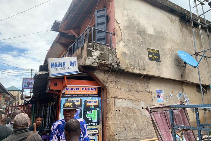 The distressed structure marked for demolition in Alaba Market.