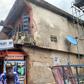 The distressed structure marked for demolition in Alaba Market.