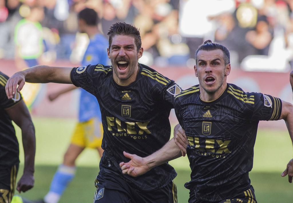 Ryan Hollingshead (left) of the Los Angeles Football Club celebrates with Gareth Bale (right) after making a tying goal in overtime during their MLS on November 5, 2022.