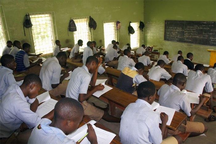 Secondary School students writing WAEC exams.