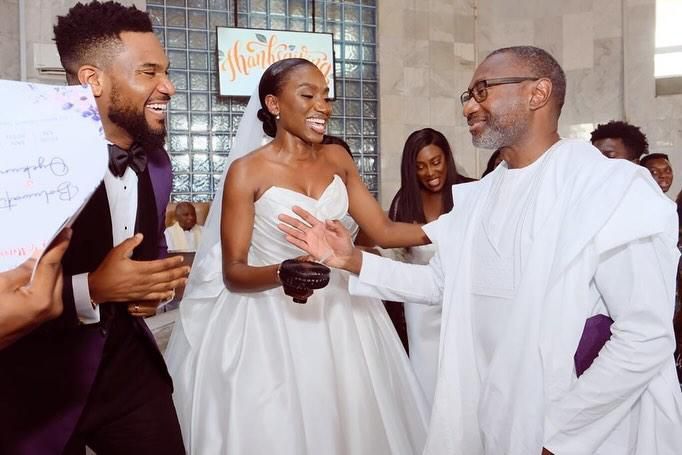 Kunle Remi, Tiwi and Femi Otedola all smiles at the church wedding [Instagram/Femiotedola]