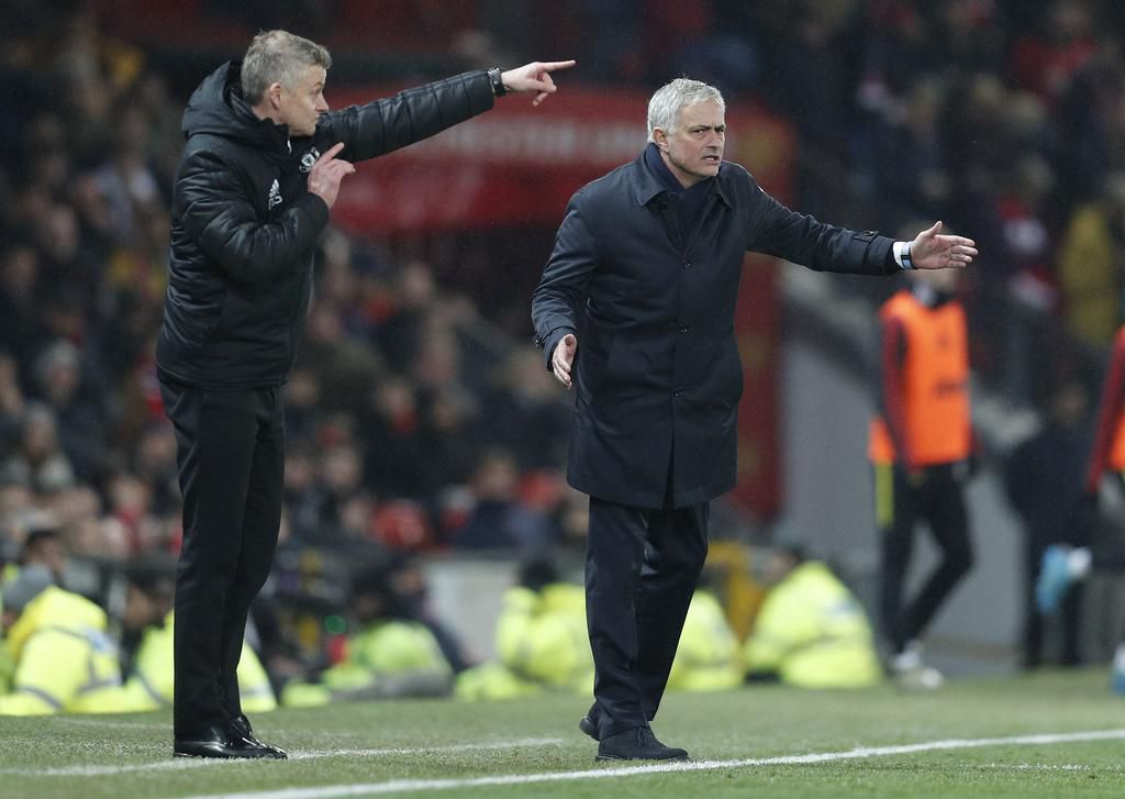 Tottenham Hotspur s Manager Jose Mourinho (R) and Manchester United, ManU s Manager Ole Gunnar Solskjaer both react during the Premier League match at Old Trafford, Manchester.