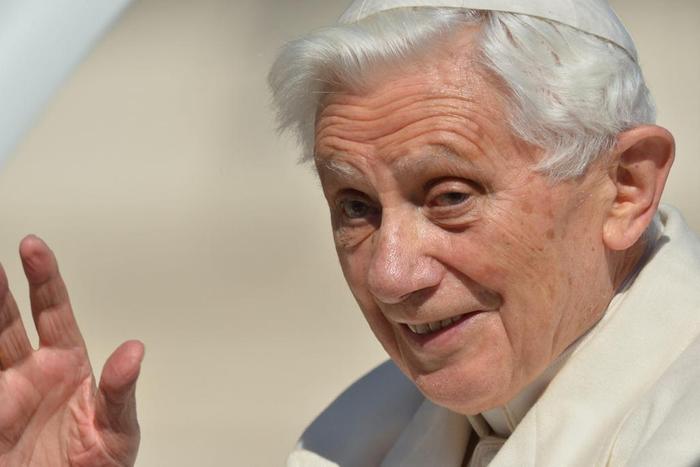 Pope Benedict XVI waves from the altar as he arrives on St Peter's square for his last weekly audience on February 27, 2013 at the Vatican.Gabriel Bouys/AFP/Getty Images
