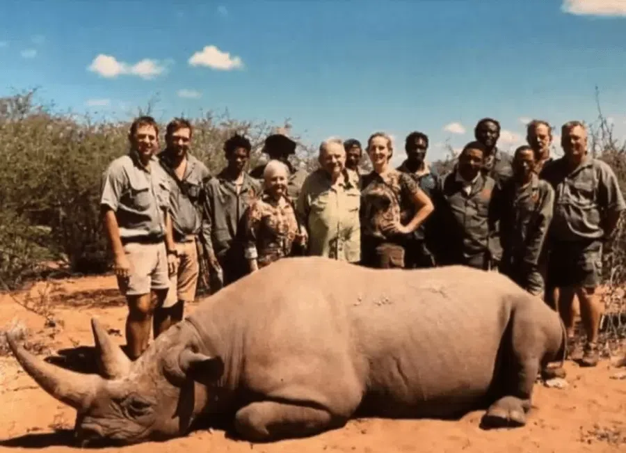 Lacy Harber with his hunting crew and the rhino he killed [ATI]