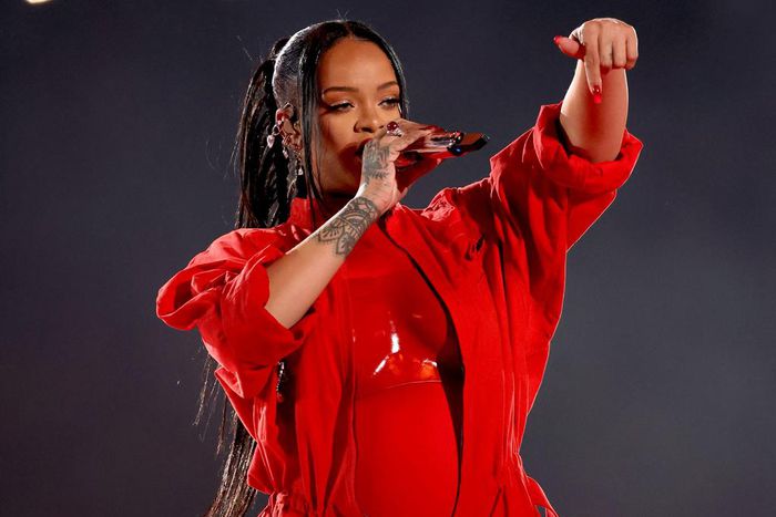 Rihanna strategically chose an unzipped red jumpsuit to reveal that she is pregnant during her 2023 performance.