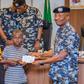 Egbetokun presents ₦535.6m cheques to families of deceased officers. [Twitter:@PoliceNG]