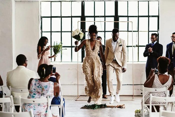 Jumping the broom is a positive omen and tradition [Robynashleyweddings]
