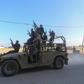 Palestinian militants ride an Israeli military vehicle that was seized by gunmen who infiltrated areas of southern Israel, in the northern Gaza Strip.Ahmed Zakot/REUTERS