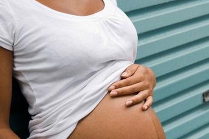 Black pregnant teenager [Alamy]