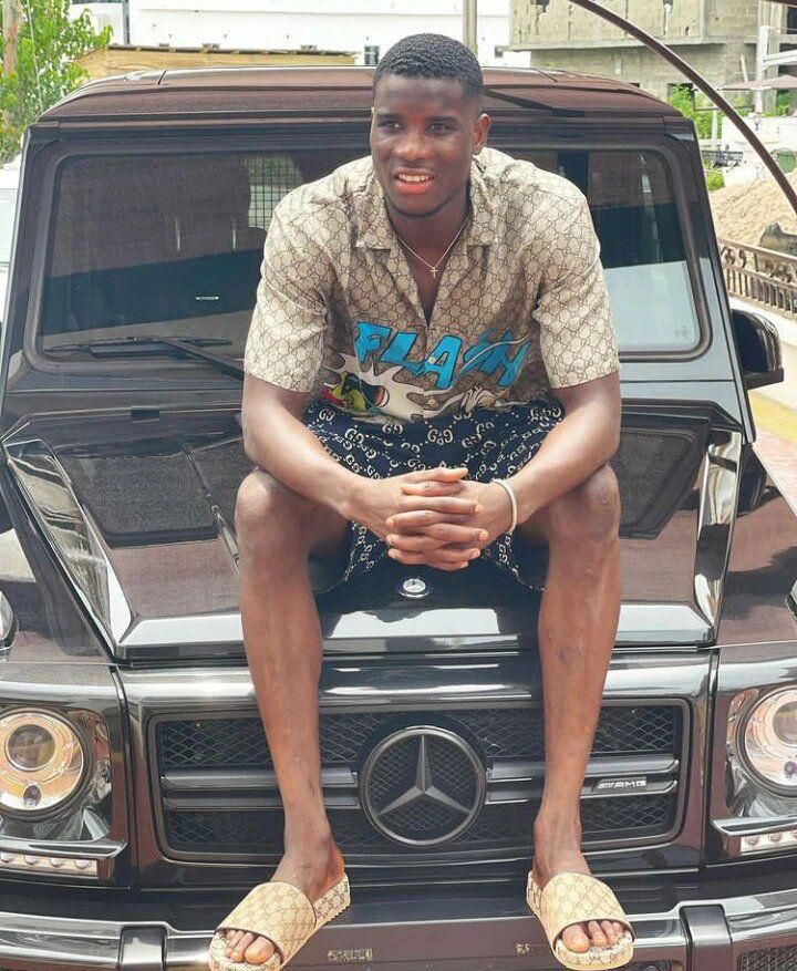 Onuachu posing with his G-Wagon