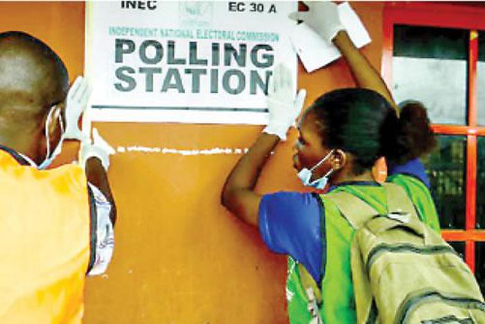 INEC officials at a polling unit. (Tribune)
