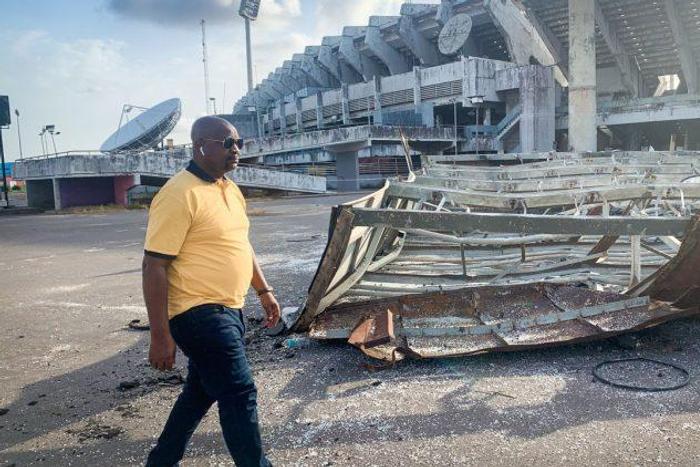 Minister of Youths and Sports Development, Sunday Dare during the inspection tour of the collapsed National Stadium Floodlight mast on Friday.