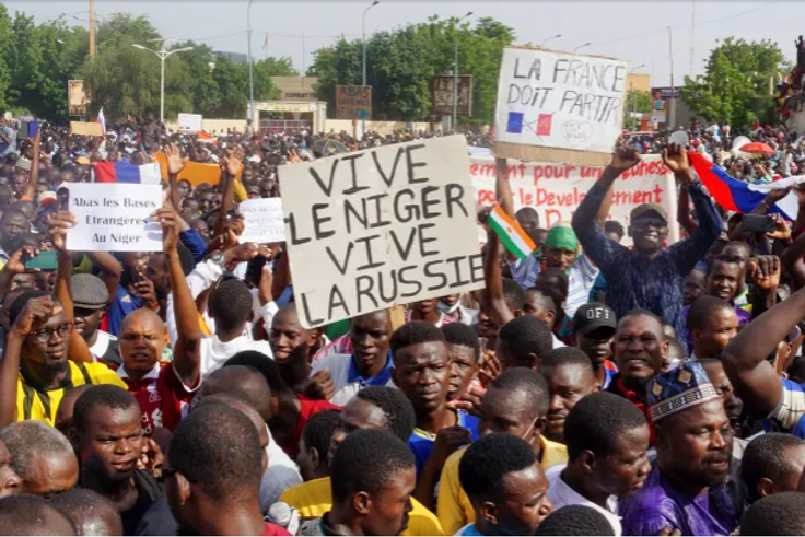 Nigeriens celebrating the military overthrow of President Bazoum. [Aljazeera]