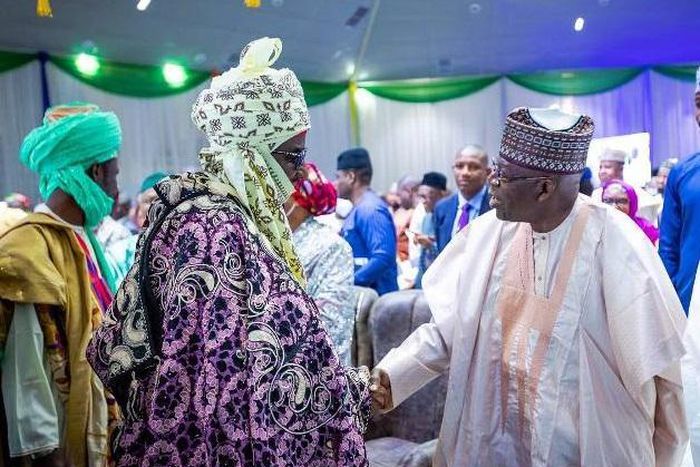 President Bola Tinubu exchanging handshake with former Emir of Kano State, Sanusi Lamido Sanusi. [Twitter:@EzumaAndre2745]