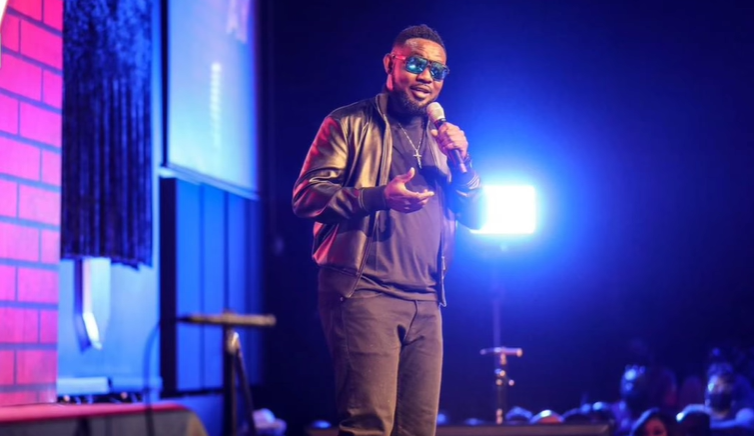 Ayodeji "AY" Makun during the performance of AY: Spotting the Difference [Instagram/@aycomedian]