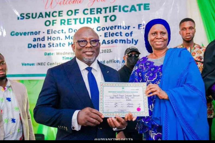 Delta Gôv. elect, Chief Sheriff Oborevwori receiving his certificate of return from INEC Nat. Commissioner, supervising Cross River, Delta and Edo States, Prof Rhoda Gumus on Wednesday in Asaba.