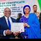 Delta Gôv. elect, Chief Sheriff Oborevwori receiving his certificate of return from INEC Nat. Commissioner, supervising Cross River, Delta and Edo States, Prof Rhoda Gumus on Wednesday in Asaba.