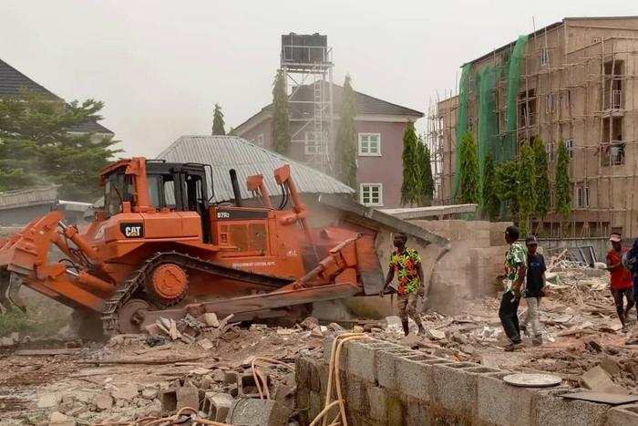 Some of the illegal buildings being demolished by officials of FCTA on Thursday. [NAN]