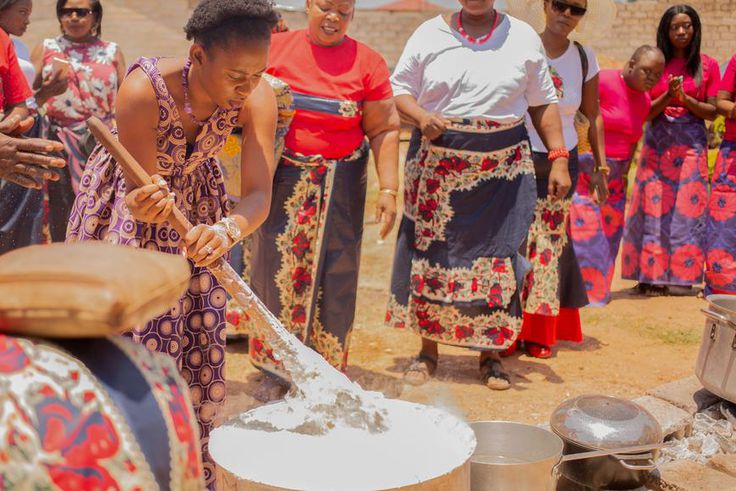 The bride assisted by her family cooks for her husband [Eater]
