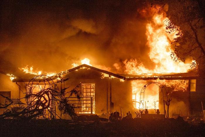 A house burns on Platina Road during the Zogg Fire near Ono, California, in 2020.