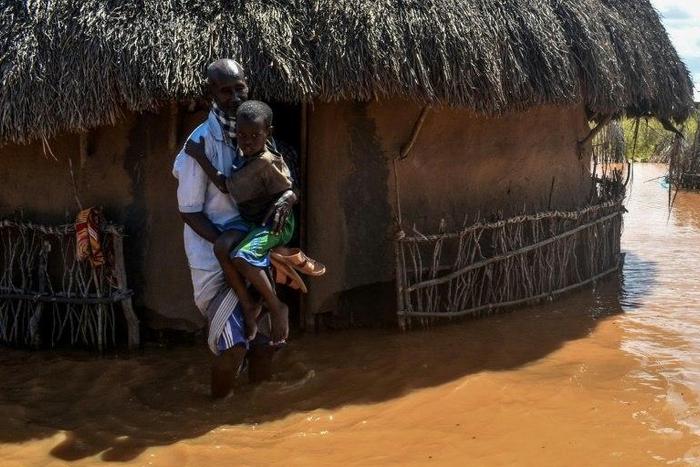 Villagers at Onkolde in Kenya's Tana River delta region struggled with flood water after the river burst its banks. More than 60,000 people have displaced from the area, according to the Kenya Red Cross.