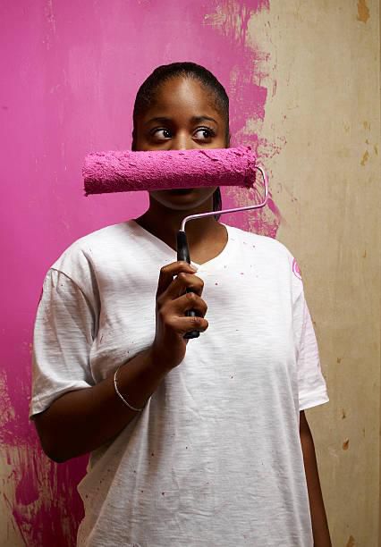 Woman holding a painting roller
