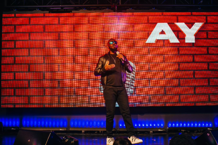 Ayodeji "AY" Makun during the performance of AY: Spotting the Difference [Instagram/@aycomedian]