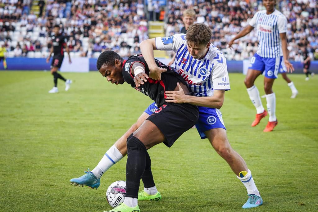 Raphael Onyedika shielding the ball