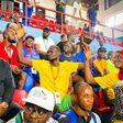 sports minister, Sunday Dare with spectators in Asaba.