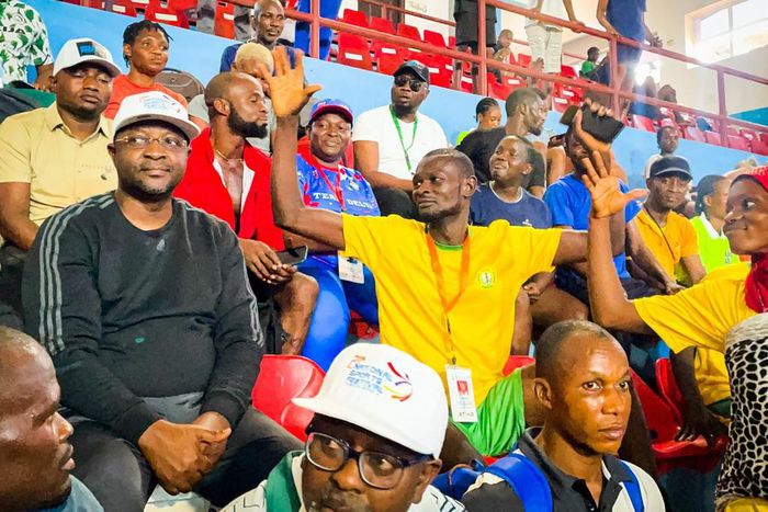 sports minister, Sunday Dare with spectators in Asaba.