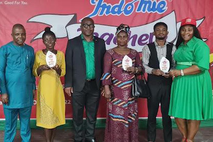 L-R: Teacher and 2nd Place Winner, Indomie Fan Club Teachers Quiz Competition (IFC TQC), Mr Temitope Bankole of Mbari Mbayo School Lagos State; Head, Department of Science Education, Faculty of Education, University of Lagos, Prof. Sunday Adeyemo; Teac...