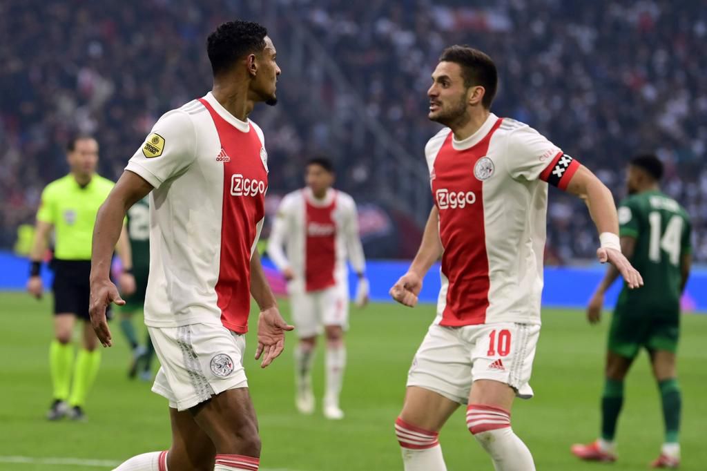 Sebastien Haller of Ajax, Dusan Tadic of Ajax celebrate the 1-1 during the Dutch Eredivisie match between Ajax and Feyenoord at the Johan Cruijff ArenA on March 20, 2022 in Amsterdam, Netherlands
