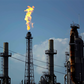 FILE - In this Thursday, Aug. 31, 2017, file photo, a flame burns at the Shell Deer Park oil refinery in Deer Park, Texas. Oil prices are plunging Sunday, March 8, 2020, amid worries that an OPEC dispute will lead a virus-weakened economy to be awash i...