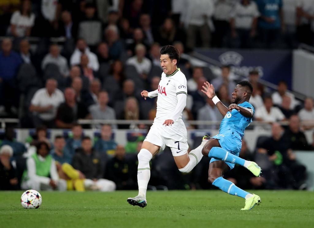 Son Heung-Min of Tottenham Hotspur is fouled by Chancel Mbemba