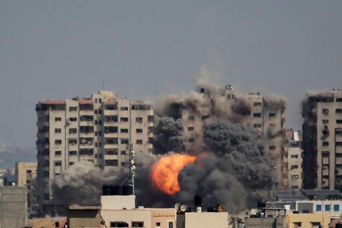 An Israeli strike on a residential tower in Gaza City on October 12.Ahmad Hasaballah/Getty Images