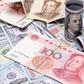 yuan to dollar (ShanghaiDaily)