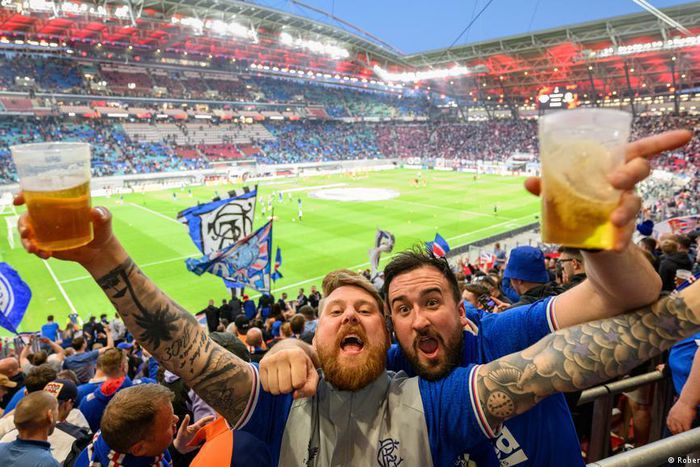 Fans with beer at a stadium