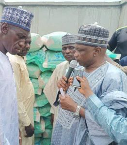 Former Zamfara Commissioner for Education, Alhaji Ibrahim Danmalikin-Gidangoga representing Lawmaker-elect for Bungudu/Maru Federal Constituency, Alhaji Abdulmalik Zubairu during the inauguration of sale and distribution of subsidised fertilizer to far...