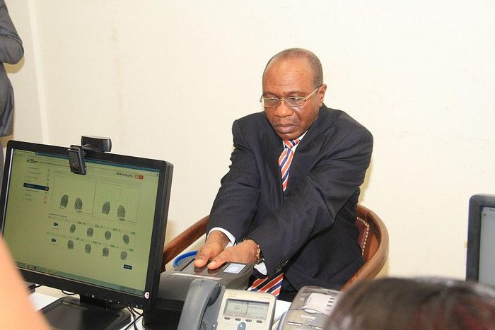 Godwin Emefiele, Governor of the Central Bank of Nigeria during a biometric exercise