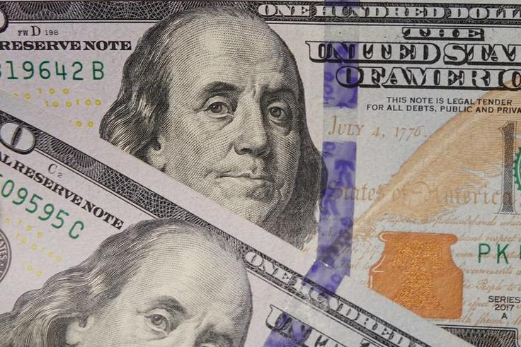 100 dollar bills seen displayed.(Photo Illustration by Sheldon Cooper/SOPA Images/LightRocket via Getty Images)