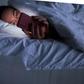 A woman lies in bed on her smartphone.Sergey Mironov/Getty Images