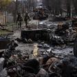 Soldiers walk amid destroyed Russian tanks in Bucha, in the outskirts of Kyiv, Ukraine, April 3, 2022.AP Photo/Rodrigo Abd, File