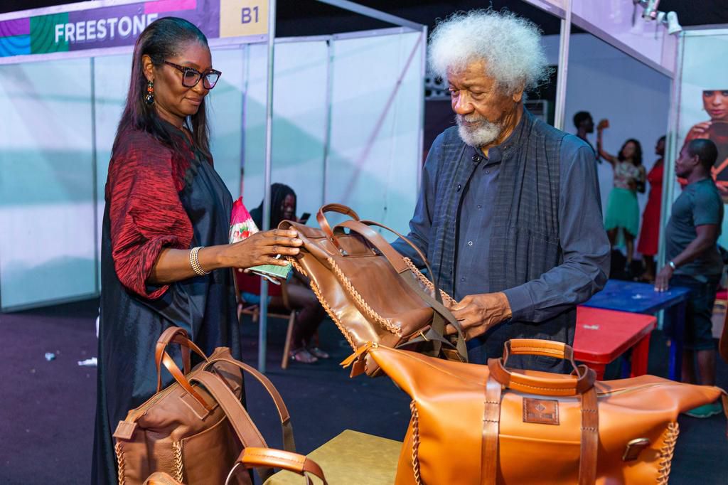 Mrs. Femi and Prof. Wole Soyinka going through the leather wears at the opening of the Lagos Leather Fair.