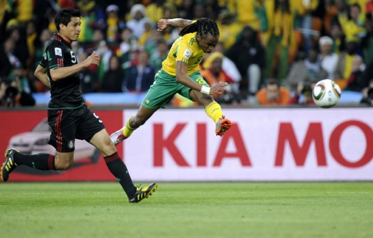 Siphiwe Tshabalala (R) from hosts South Africa scores the first goal of the 2010 World Cup, against Mexico in a drawn group match