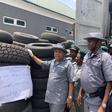 Ag Comptroller, Federal Operations Unit Zone ’C’ of the Nigeria Customs Service, Mr Kayode Kolade, a Deputy Comptroller of Customs (DC), displaying contraband seized by the Zone in Owerri, on Wednesday.
