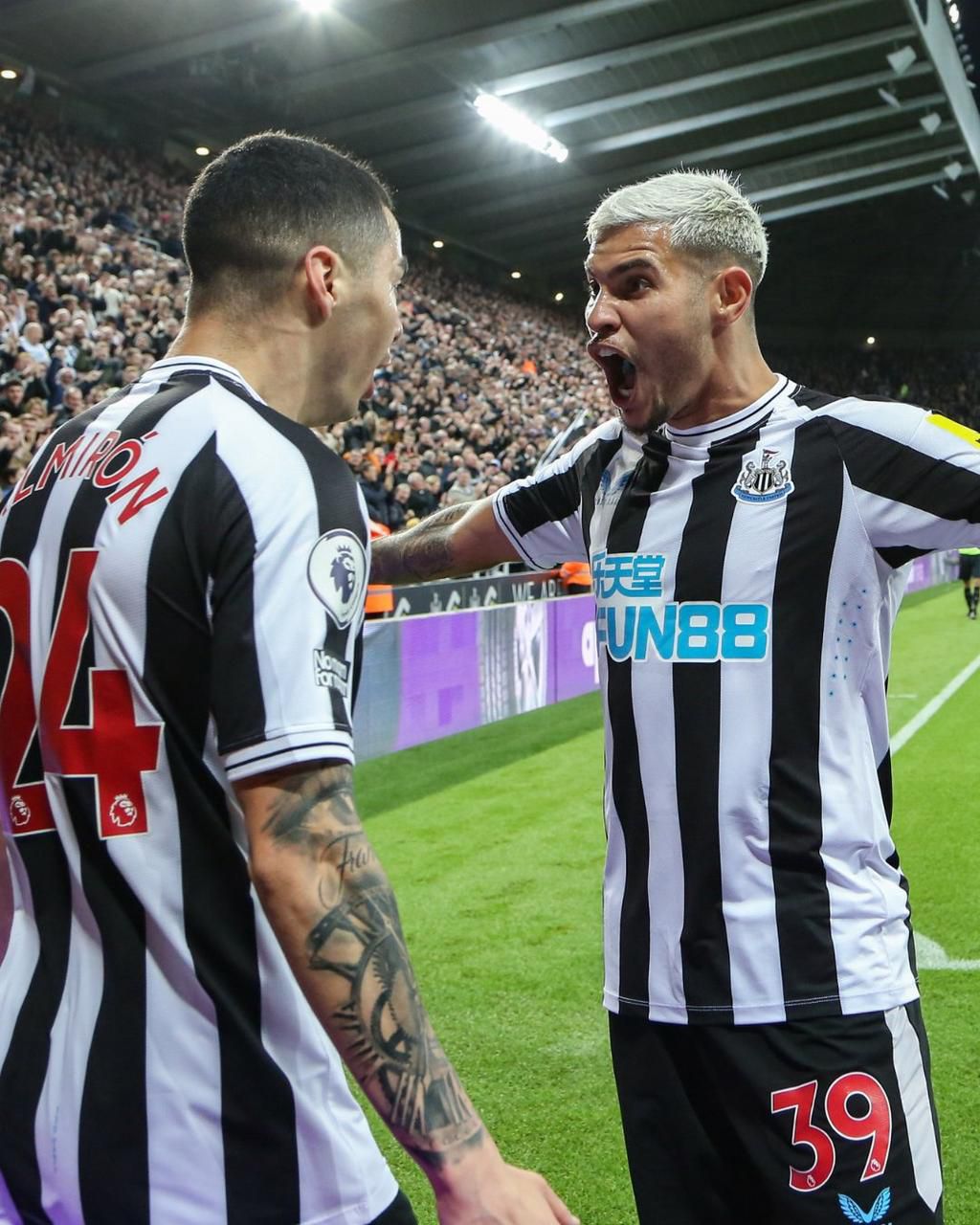 Match winner, Almiron, celebrates his goal with teammate Bruno.