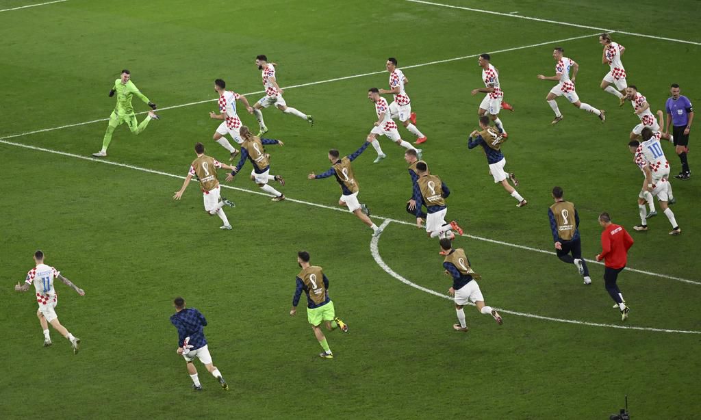 Croatia players celebrate knocking out Brazil