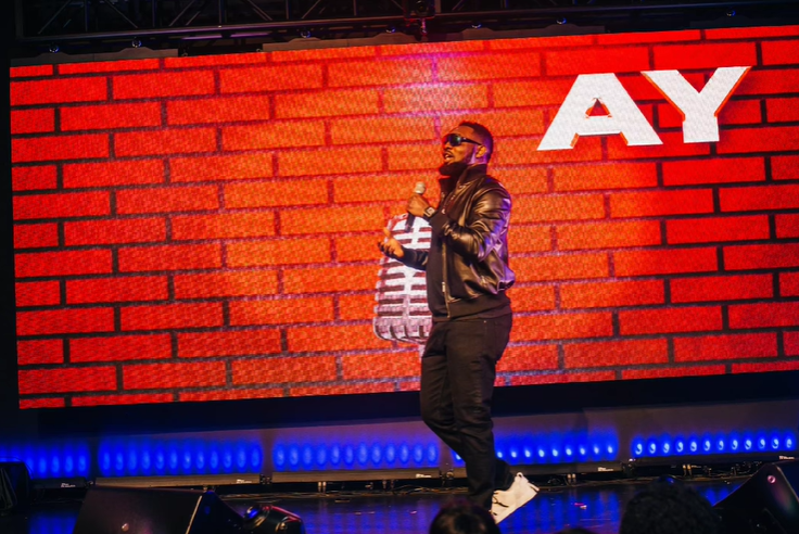 Ayodeji "AY" Makun during the performance of AY: Spotting the Difference [Instagram/@aycomedian]