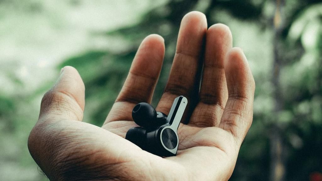 Wireless earphones in a person's hand [Image: Swamy K]